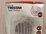a box of a white fan heater sitting on a table