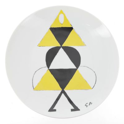 une assiette blanche ornée d'un motif jaune et noir