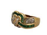 a close up of a gold ring with a green and white stone