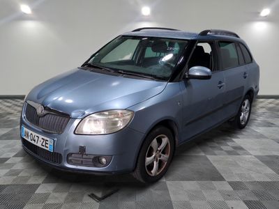 a picture of a small blue car parked in a garage