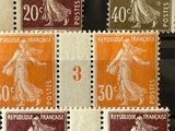 four different stamps with a woman in a dress on them