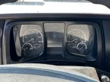 a close up of a dashboard of a car with gauges