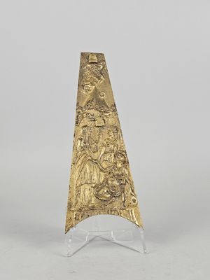a gold cone shaped object on a clear stand with a white background