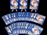 a lot of pokemon cards that are on the table