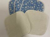 a close up of a pair of cloth pads on a table