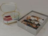 a box with a mirror and a pair of scissors in it