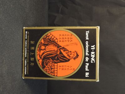 a box of cigarettes sitting on a black surface
