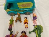 the scoozies are playing with their toys on the bed