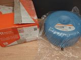 a blue disc sitting on top of a box on a table