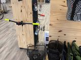 a rack with umbrellas and bags on it in a store
