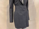 a mannequin dressed suit on a mannequin stand