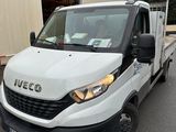 a white van that is parked in front of a building