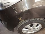 a close up of a car that has a denting on it