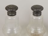 three salt and pepper shakers on the table