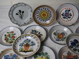 a lot of plates that are on a table