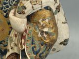 a figurine of a man with a hat on