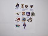 some of the badges are on a piece of paper on the wall