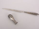 a knife and a spoon sitting on a table
