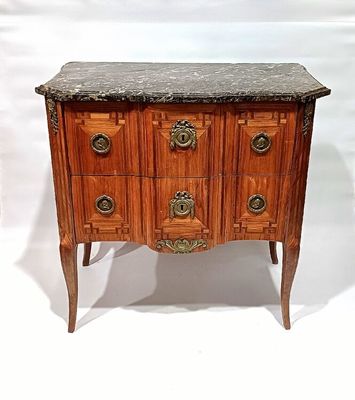a marble top chest of drawers on a wooden stand