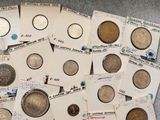 a lot of old coins on the table together