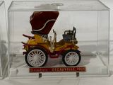 a small model of a car in a clear box