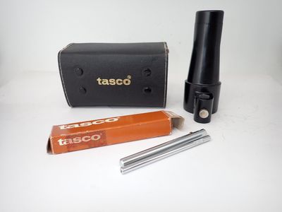 a small black tube and a black case on a white table