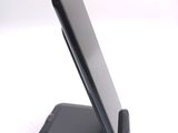 a cell phone that is sitting on top of a stand