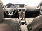 a picture of a car interior with a steering wheel and dashboard