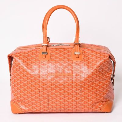 a small orange bag with a logo on the front