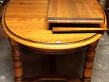 a wooden table with a laptop on top of it