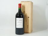 a bottle of wine sitting next to a wooden box