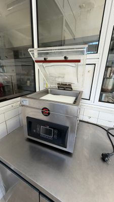 a silver counter top with a silver oven on it
