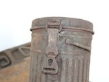 a metal trash can sitting on top of a table