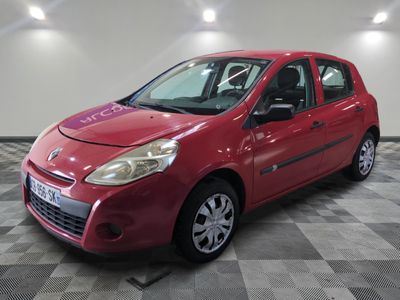 a picture of a red car parked in a garage