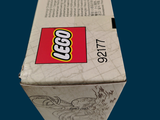 a box of legos sitting on a blue surface
