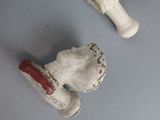 two figurines that are sitting on a table