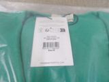 a green t - shirt with a price tag on it