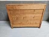 an old wooden chest of drawers sitting on top of a tiled floor