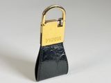 a small black purse with a gold lock on it