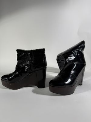 SONIA RIKYEL Paire de bottes en cuir verni noir à talons com…