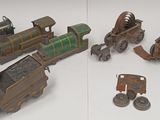 many different types of toy trains on the table