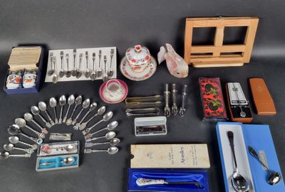 a lot of silverware and other items on the table
