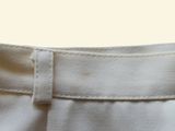 a close up of a pair of pants with a button on the side