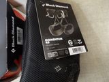 a box of black diamond momentum shoes next to a pair of black diamond momentum shoes
