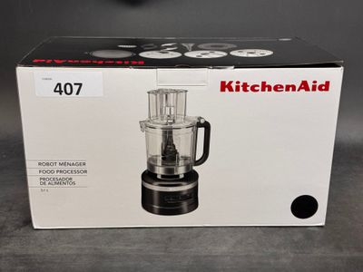 packaging of a kitchenaid food processor in a box on a table