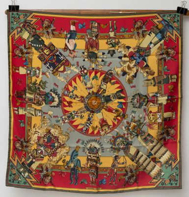an image of a colorful tapestry hanging on a wall