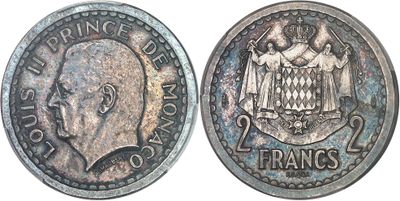 a close up of a coin with a face on it