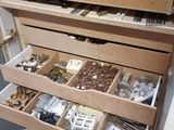 a drawer full of assorted items in a room