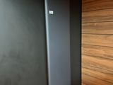 a radiator in the corner of a room next to a wall