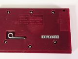 an image of a close up of a red device on a white surface